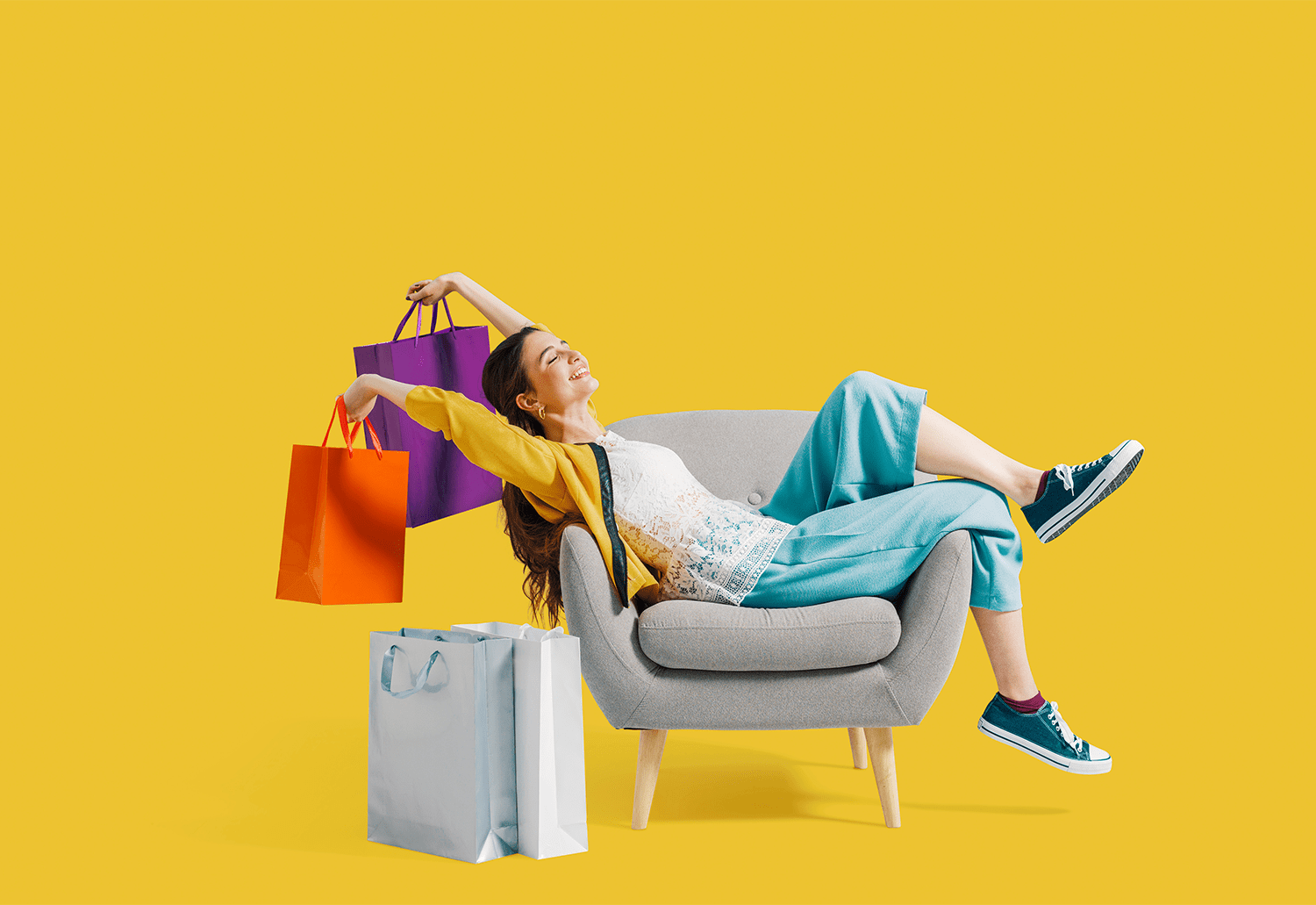 woman relaxing with shopping bags